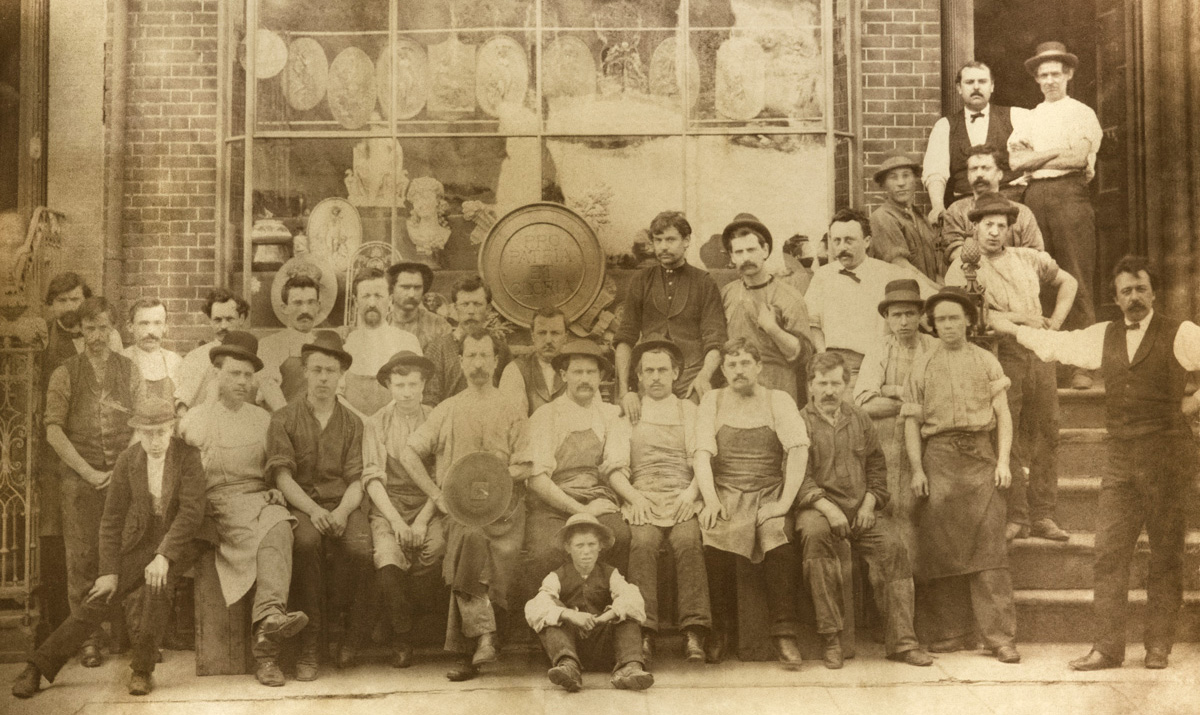 Historic photo of foundry workers and P.E. Guerin in front of a former location in New York City